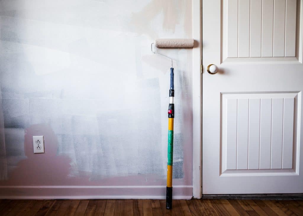 paint-roller-on-the-wall-scaled-1